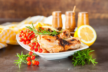 chicken legs a grill with seasonings on a table, selective focus