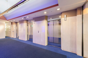 Office interior, hall with three elevators