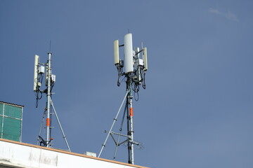 Telecommunication pole of 3G, 4G, 5G cellular antenna, small cell site base station on the rooftop...