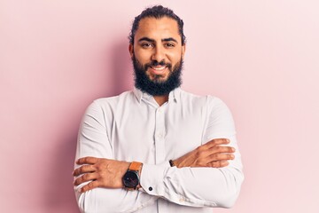 Fototapeta premium Young arab man wearing casual clothes happy face smiling with crossed arms looking at the camera. positive person.