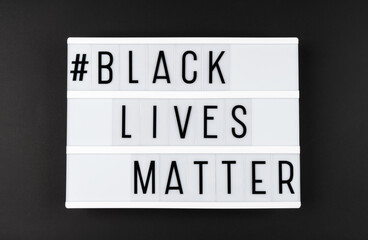 Light box with the text BLACK LIVES MATER on a black background.