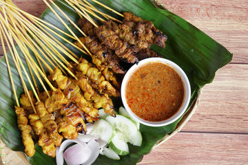 Satay is a popular Malaysia / Indonesia dish of seasoned, skewered and grilled chicken and meat,...