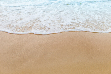 White wave on fine sand beach, nature concept background, summer outdoor day light