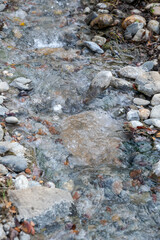 Hot spring water flowing on the rock in a morning