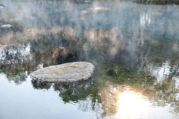 Beautiful morning fog or smoke over Huay mak leam hot spring, Lam Nam Kok National Park, Thailand
