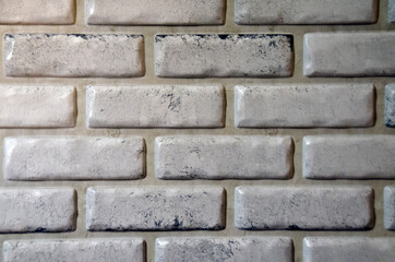 Background of a white-gray brick wall.