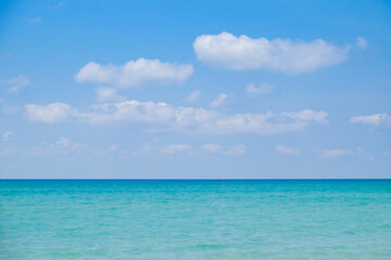 Fototapeta na wymiar blue sky and white sand