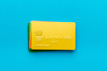 security concept. stack of credit card on blue desk top-down