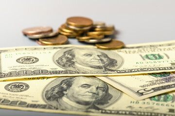 Cash banknotes and coins dollars background. Background of American money banknotes and coins.