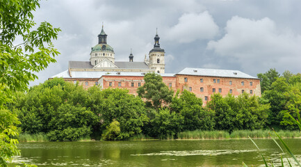 Panorama of medieval Discalced Carmelites monastery over water, Berdychiv, Ukraine