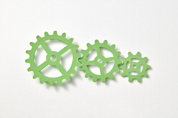 Clockwork mechanism handmade from paper on a white background.