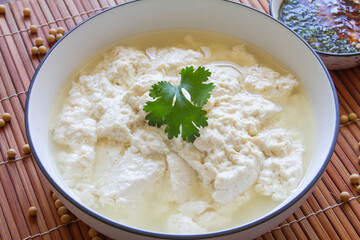 Soft tofu in water close up