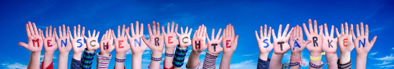 Children Hands Building Colorful German Word Menschenrechte Staerken Means Strengthen Human Rights....