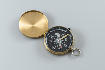 Navigation equipment for orienteering. compass on the gray background.