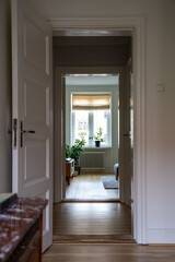 A view through multiple doors and rooms towards a window in a Scandinavian (Swedish) apartment from...