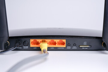 WiFi Modem Router ADSL connected with LAN RJ45 Cable. It is a LAN network connection ethernet...