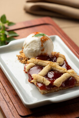 guava pie with vanilla ice cream on white plate