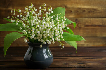 spring flowers lilies of the valley in a vase