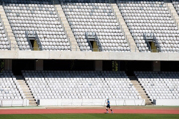 Soccer stadium with empty seats.