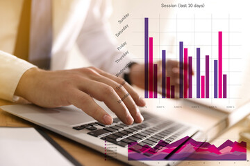 Finance trading concept. Man working with laptop and charts, closeup