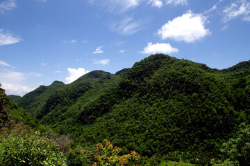 Mountain view and blue sky with beautiful white clouds.