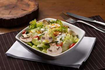 lettuce mushroom tomato salad on bowl
