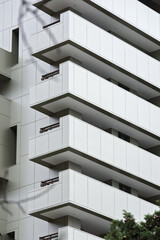 Architectural pattern from the Windows of a multi-storey building. Symbol of urban life. Beautiful geometric background of balconies. Ventilated facade of the house. Architectural drawing.