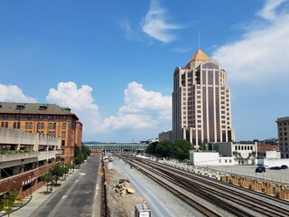 Fototapeta na wymiar railroad tracks and tall building