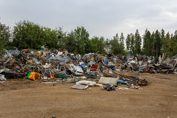 Sweden - August 17, 2011: One of the scrap yard (heap), junkyard, dump with a lot of different...