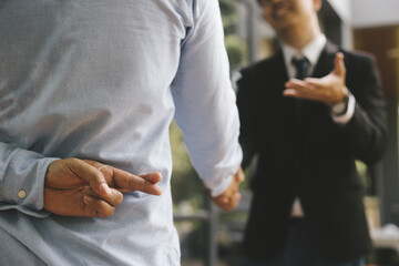 Business people shake hands with business people and work in the office.