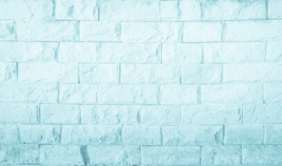 Empty blue brick wall texture background in the bedroom at lovely. Brickwork stonework interior, rock old clean concrete grid uneven abstract weathered brick design, horizontal architecture wallpaper.