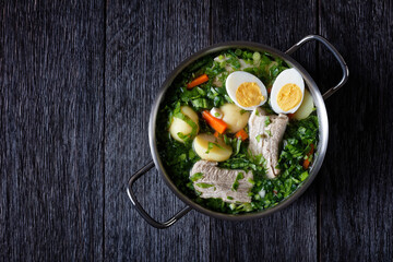 Green sorrel soup with pork and young potato