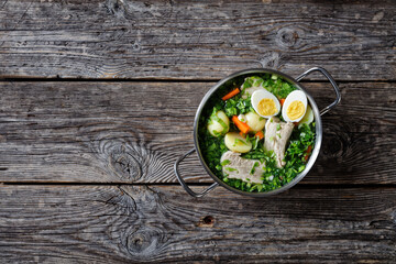 Ukrainian green borscht with eggs on a stockpot