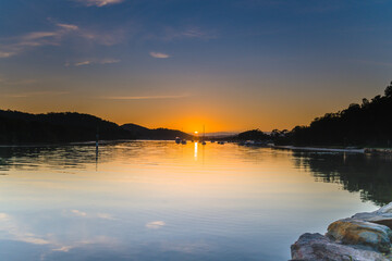 Soft and Light High Cloud Sunrise with Reflections over the Bay