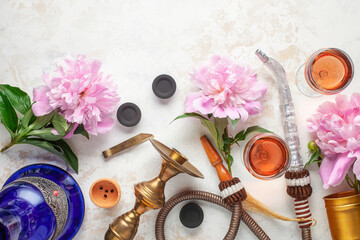 Obraz na płótnie Canvas Smoke hookah with peonies flowers, caramel and wine. Shisha concept.Modern hookah. Flat lay