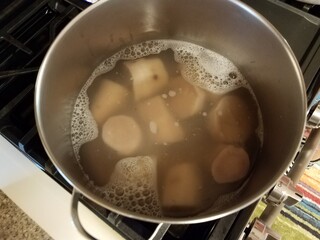 large pot of water cooking root vegetables from Puerto Rico