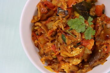 Baigan Bharta or Vangyache Bharit, a roasted and mashed eggplant fry or curry, favourite maharashtrian curry, served in a bowl, Indian traditional food