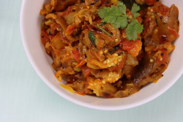 Baigan Bharta or Vangyache Bharit, a roasted and mashed eggplant fry or curry, favourite maharashtrian curry, served in a bowl, Indian traditional food