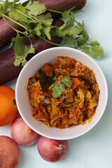 Baigan Bharta or Vangyache Bharit, a roasted and mashed eggplant fry or curry, favourite maharashtrian curry, served in a bowl, Indian traditional food