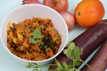 Baigan Bharta or Vangyache Bharit, a roasted and mashed eggplant fry or curry, favourite maharashtrian curry, served in a bowl, Indian traditional food