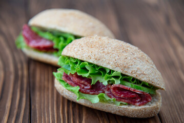 Wholegrain sandwiches with salami and lettuce