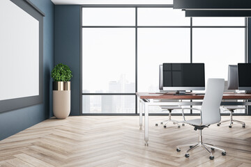 Luxury office in loft style with computers, blank billboard and city view.