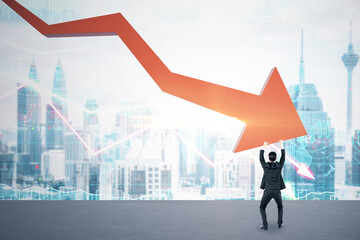 Businessman holding stock crash red arrow