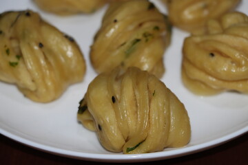 Steamed bread, typically made from wheat, prepared by steaming 