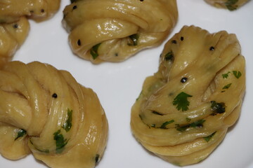 Steamed bread, typically made from wheat, prepared by steaming 