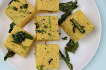 Dhokla, breakfast or snack mainly in Indian states Gujarat and maharashtra, made with a fermented batter derived from rice and split chickpeas