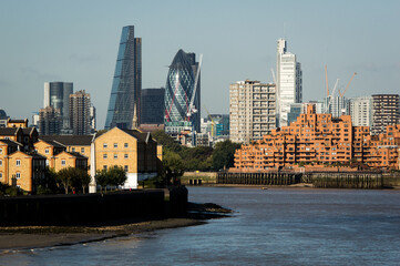 Cityscape of London over Thames River. Sunny day with blue sky.
