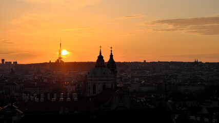 Naklejka premium Dawn over Prague. The urban skyline of an ancient European city at dusk.