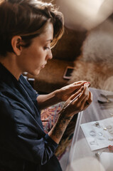 woman working in a workshop and making jewelry