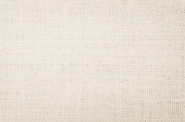 Jute hessian sackcloth canvas woven texture pattern background in light beige cream brown color blank empty